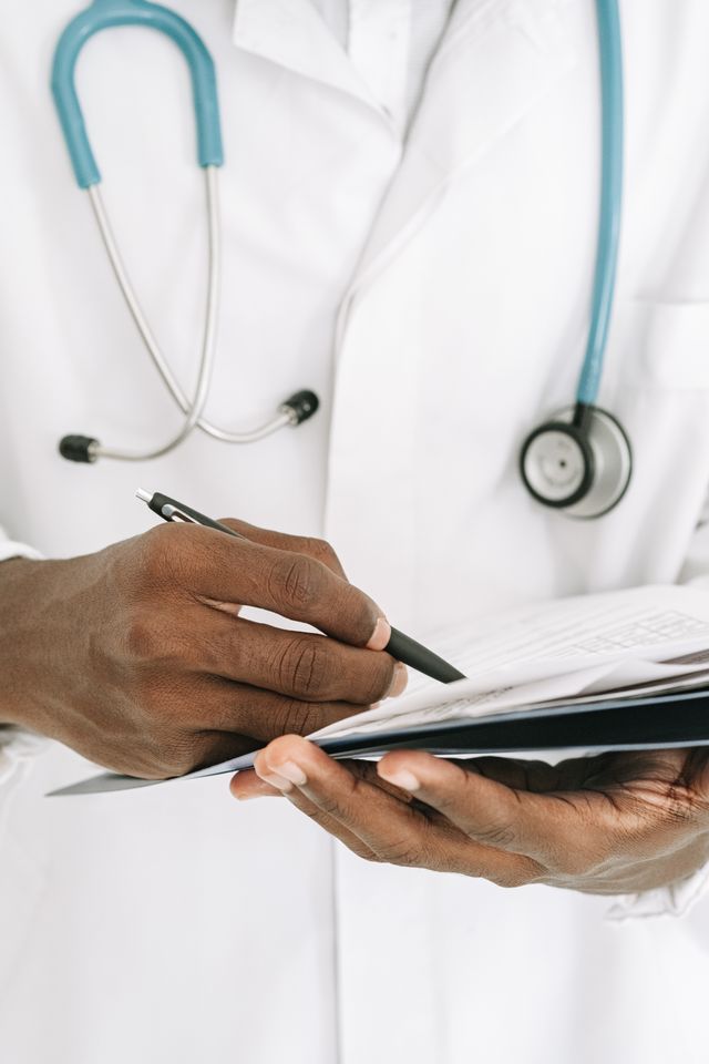 Dog owner reviewing individualized vaccine decisions and veterinary records